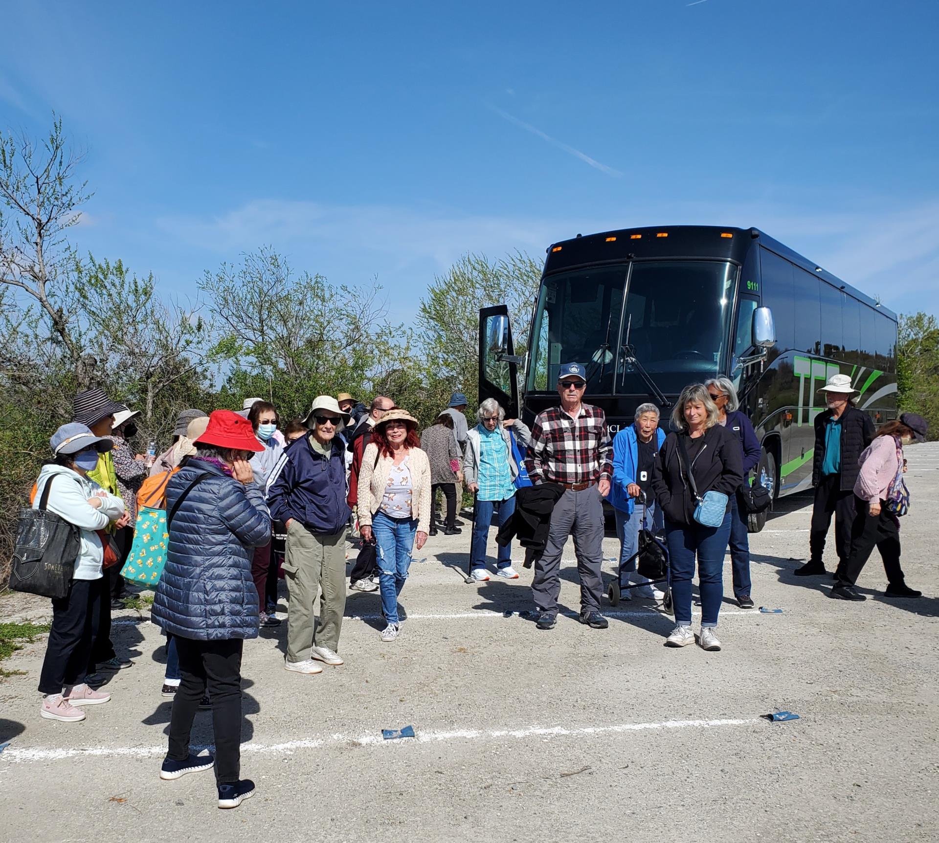 Image of Senior Citizens in front of a Bus