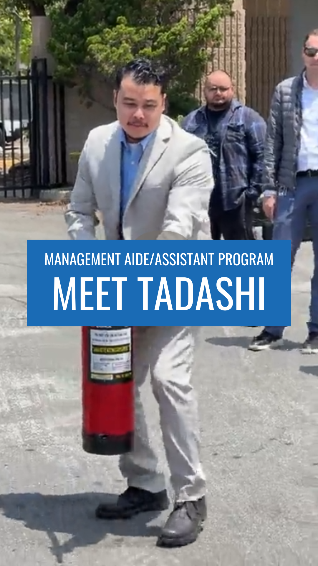 Image of a man holding a fire extinguisher with text "Management Aide/Assistant Program, Meet Tadashi"