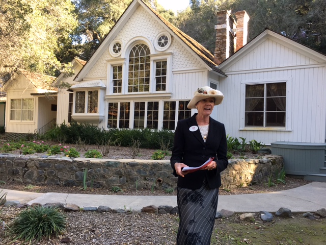 woman in front of a house