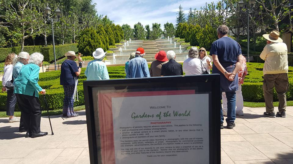 people standing in front of Gibbons Garden Fountains